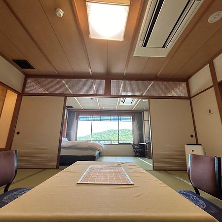 Jukeiso Hotel Hatsukaichi Bagian luar foto